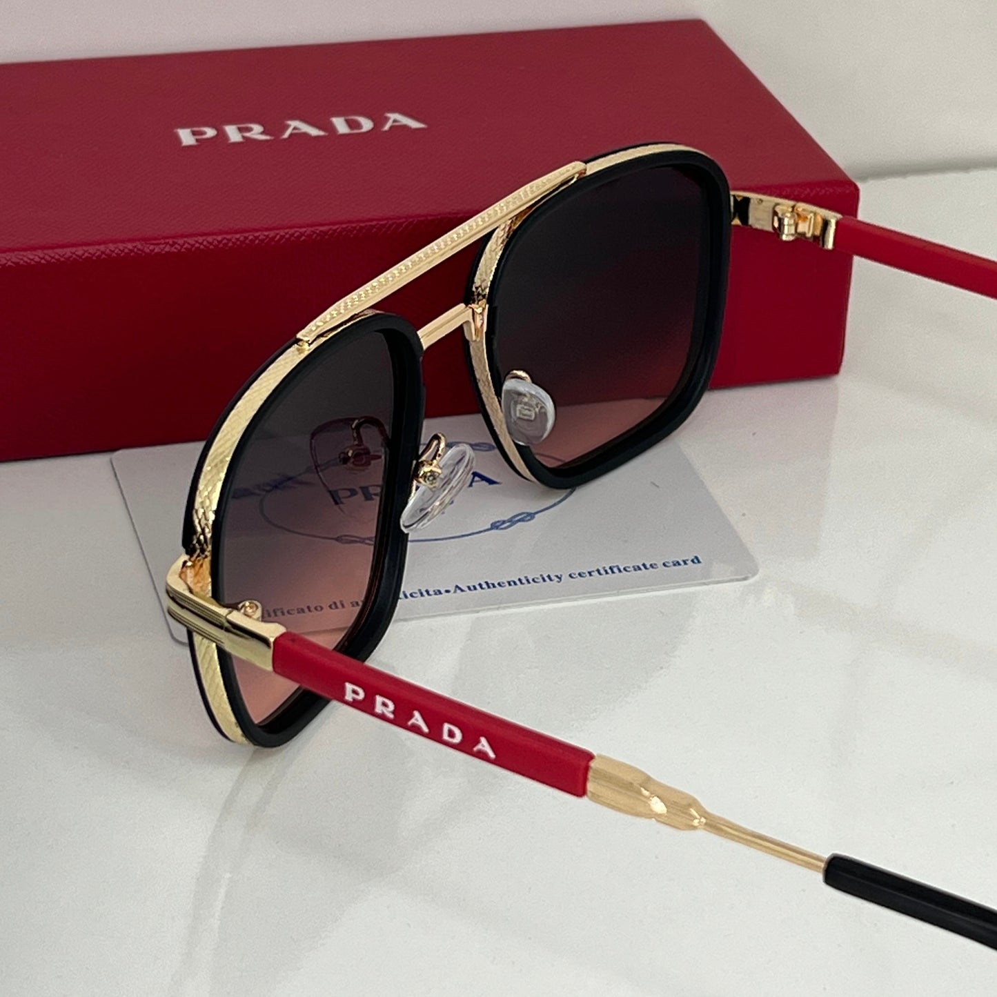 Lunettes Prada Rouge/Gold