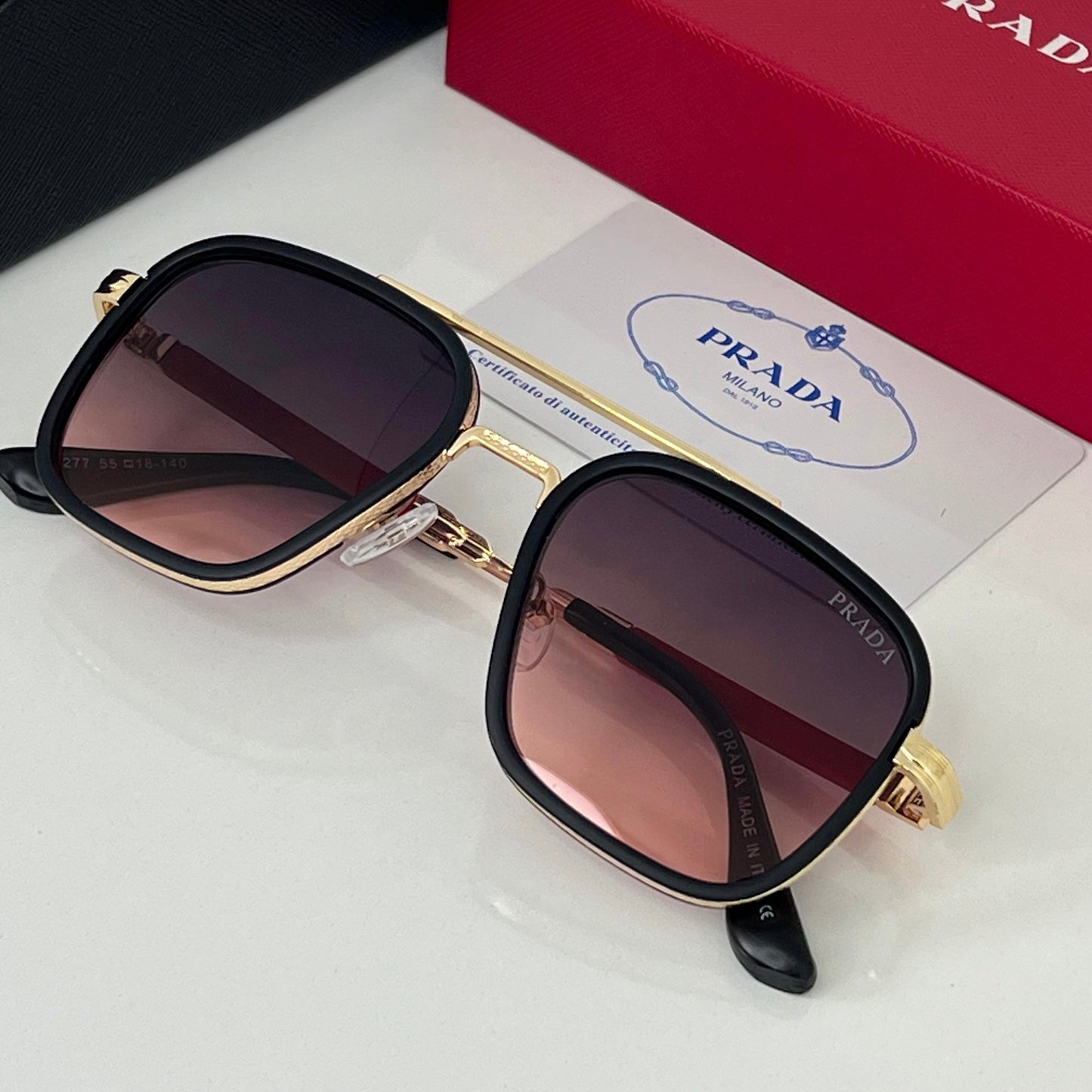 Lunettes Prada Rouge/Gold