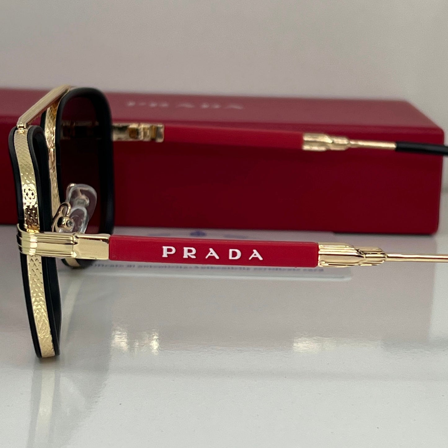 Lunettes Prada Rouge/Gold