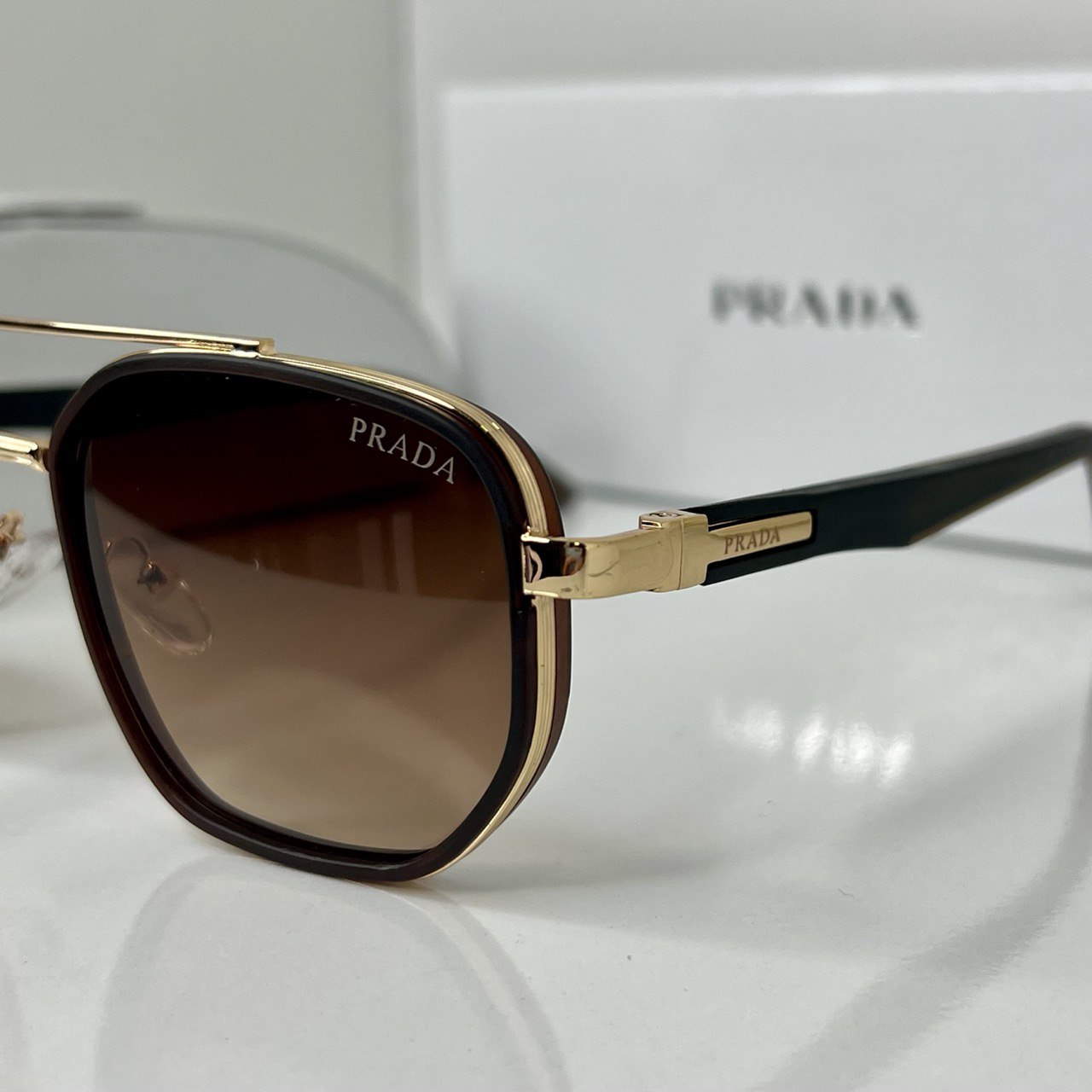 Lunettes Prada Marron