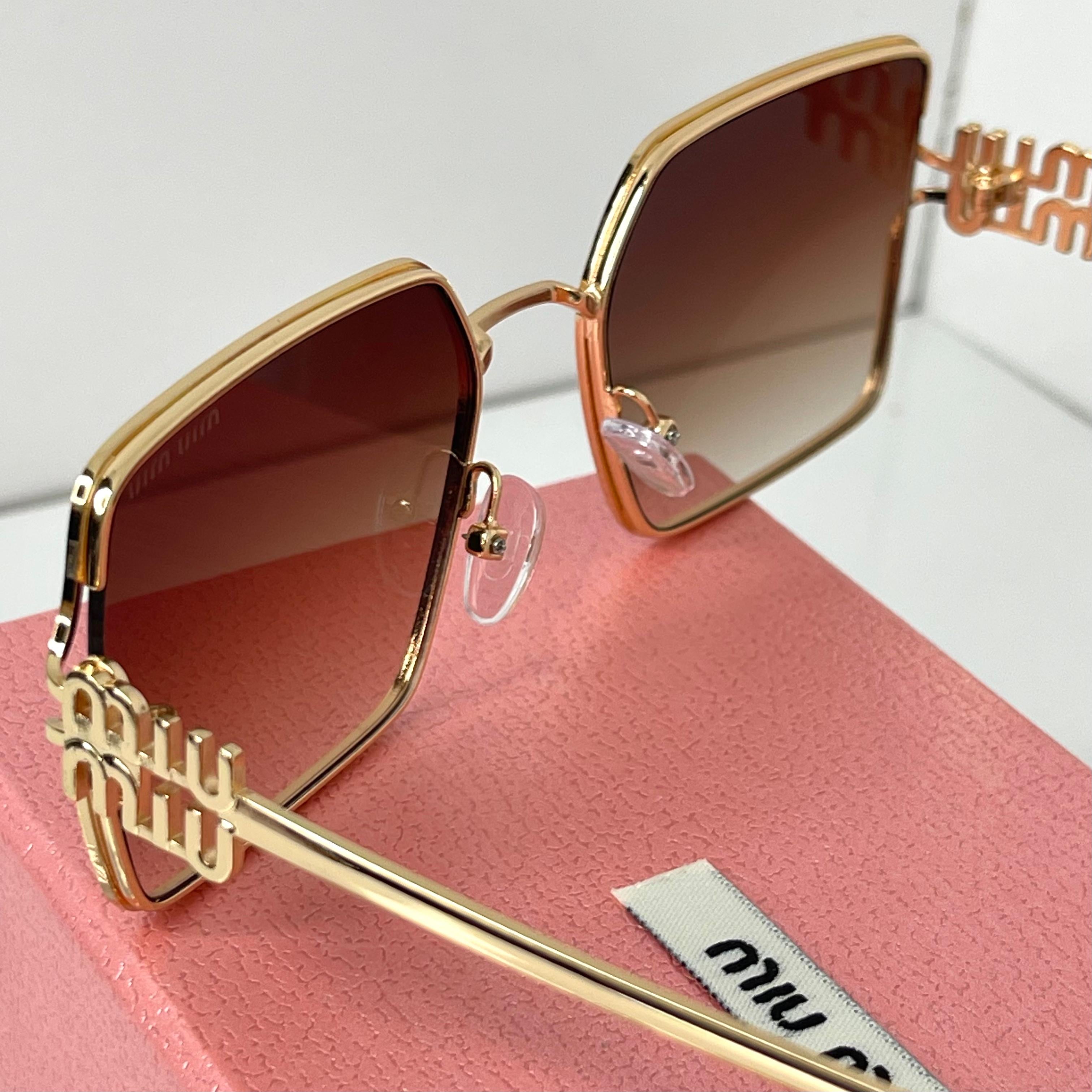 Lunettes Miu Miu Luxe Gold