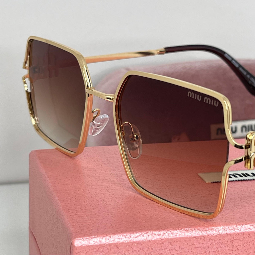 Lunettes Miu Miu Luxe Gold