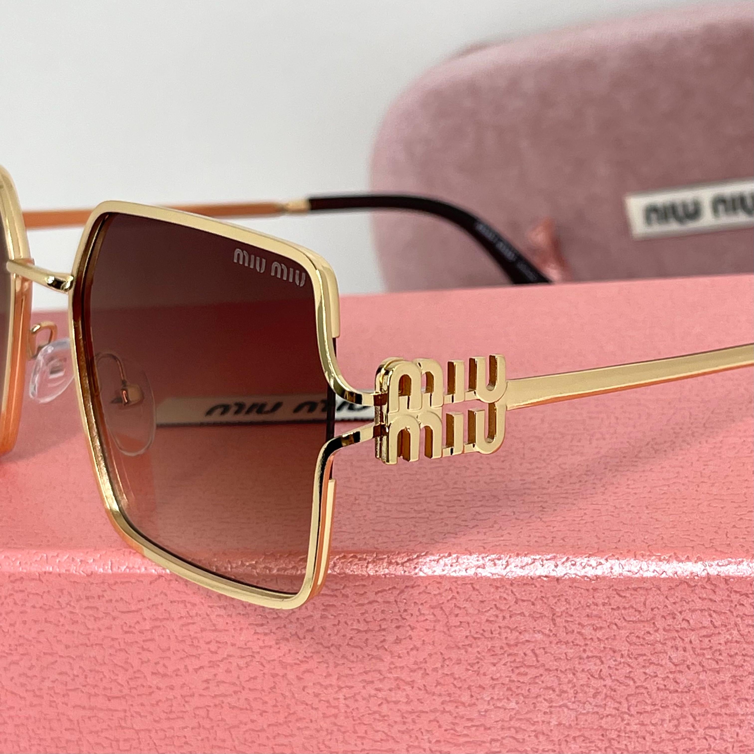 Lunettes Miu Miu Luxe Gold