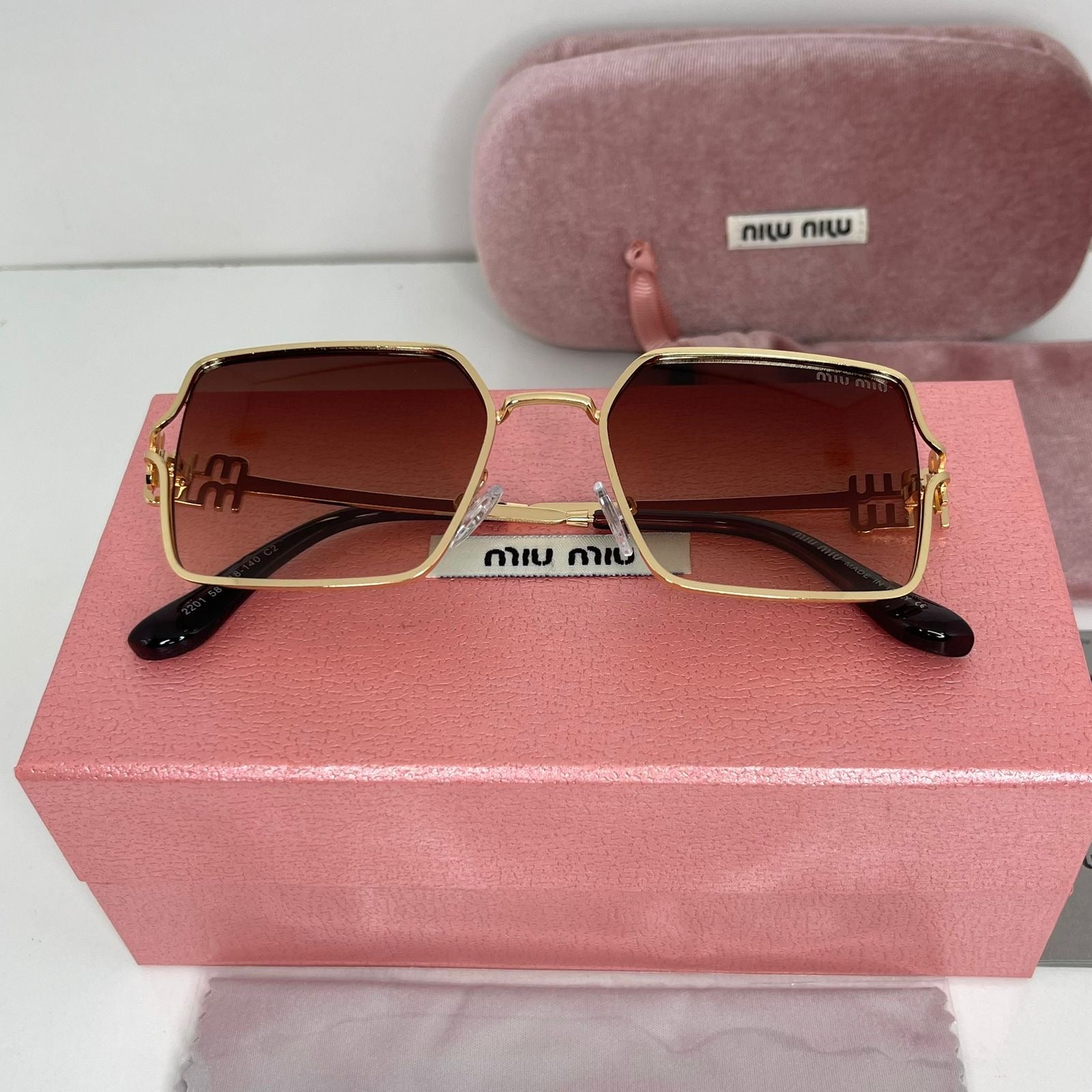 Lunettes Miu Miu Luxe Gold